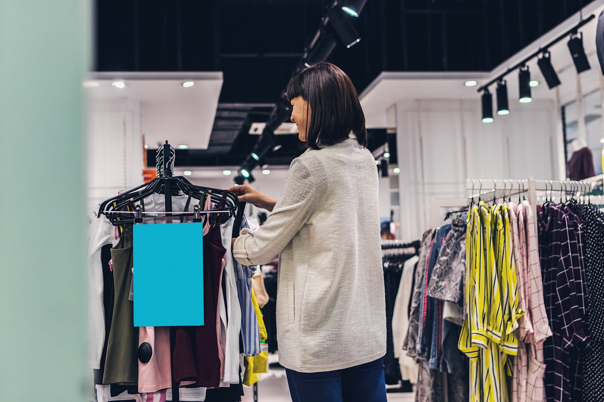 Women clothes in shopping mall. Fashion concept.